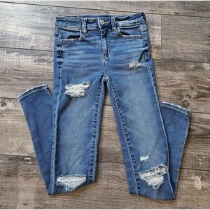 AMERICAN EAGLE High Rise Medium Light Wash Jegging Size 0